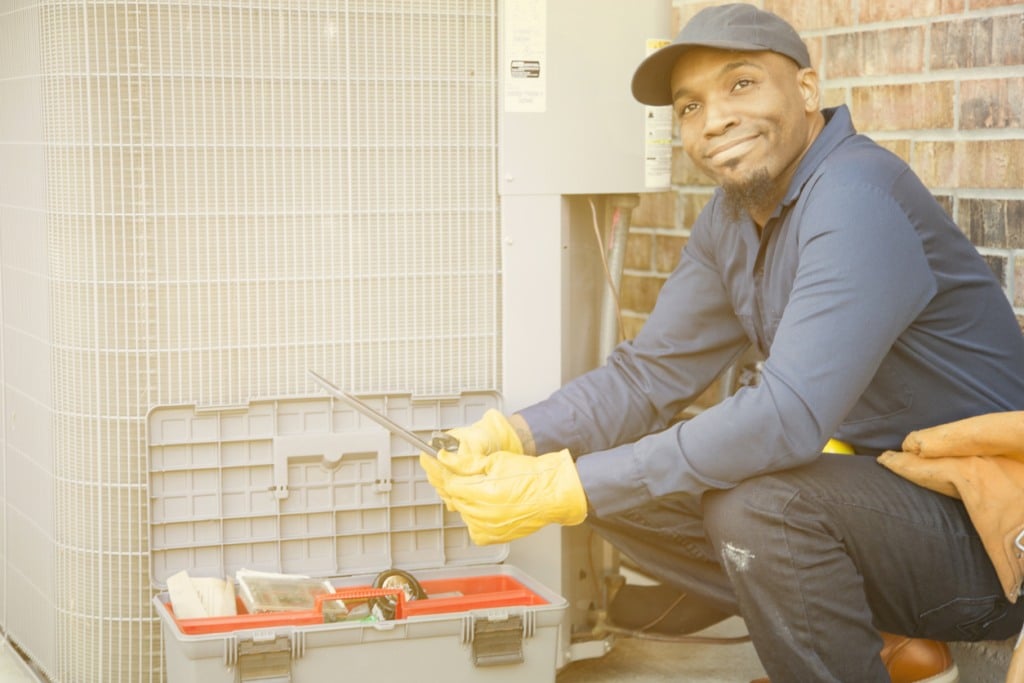 a man worker installs air conditioner in Chesapeake, VA