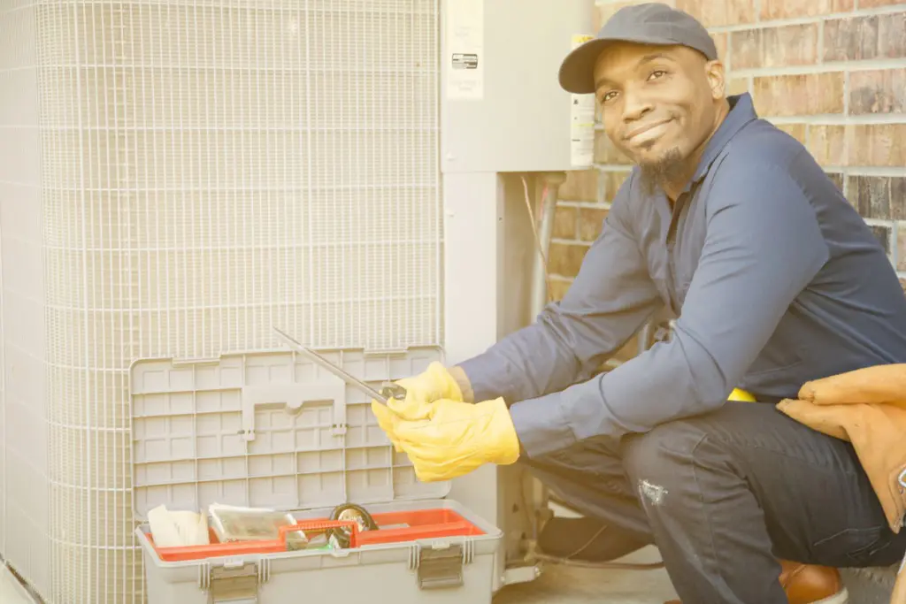 a man worker installs air conditioner in Chesapeake, VA